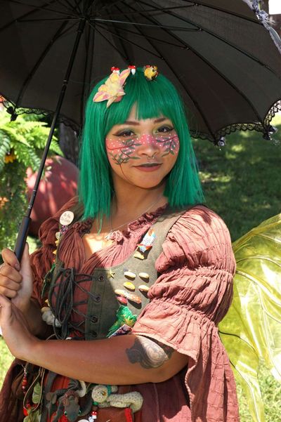 Teak holding an umbrella